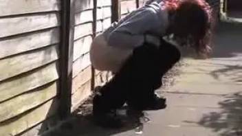 Teen girl peeing in an alley